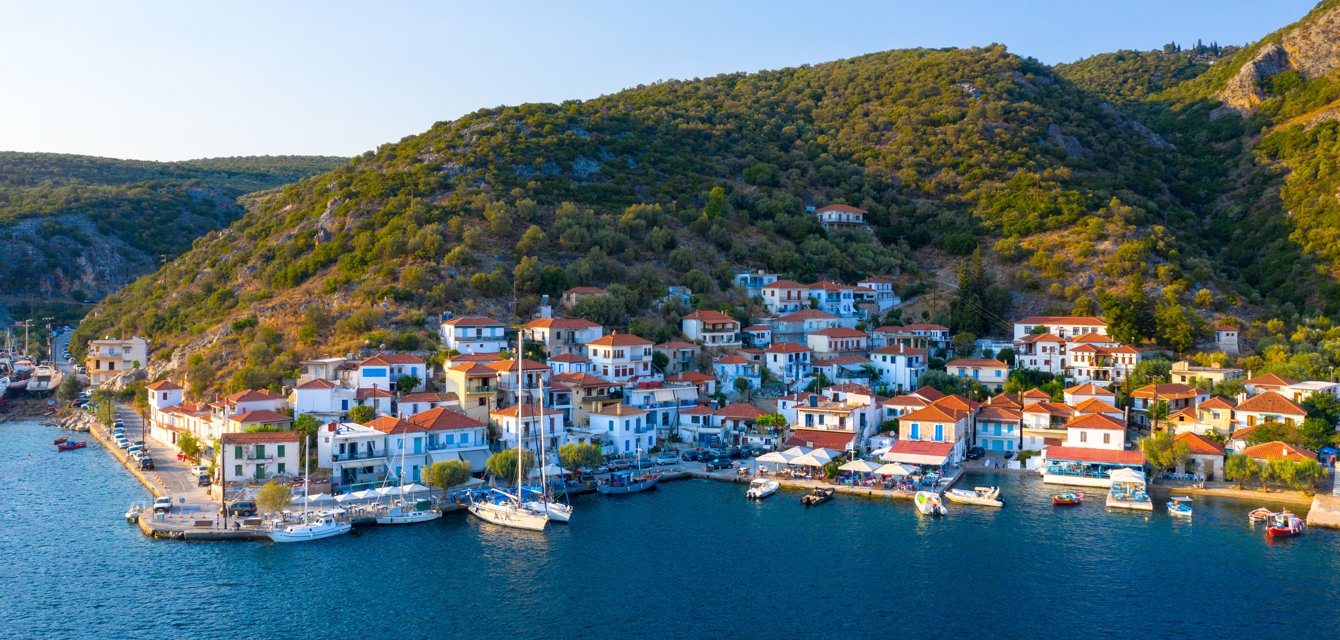 Panoramic view of Agia Kyriaki in Pagasetic Gulf, Greece with sailing boats & quaint houses
