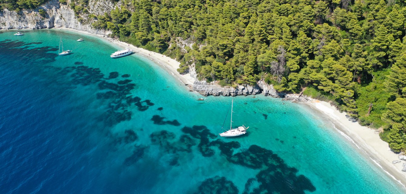 Sailing charterboats from above in Pefko, Skopelos, Greece